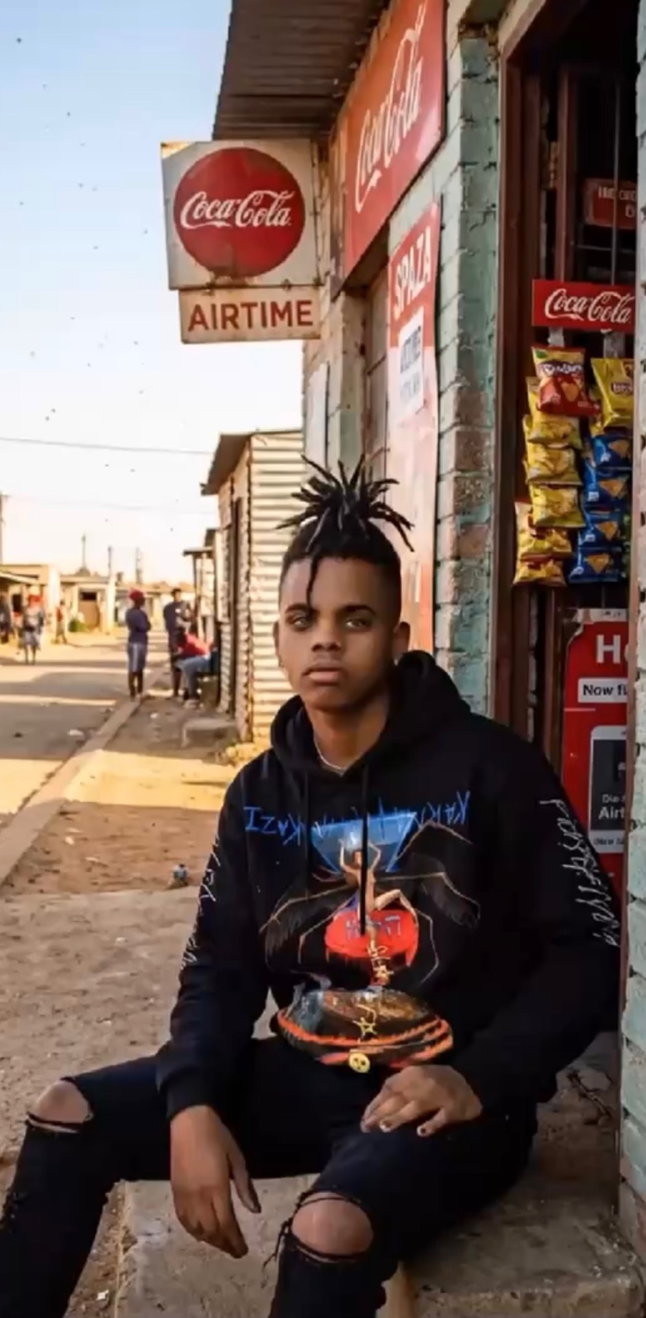 Model in a MARSILKA hoodie outside a township spaza shop